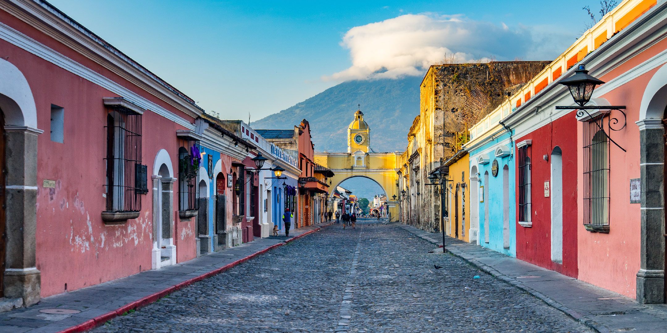 Antigua Guatemala street view with colonial buildings and bustling market